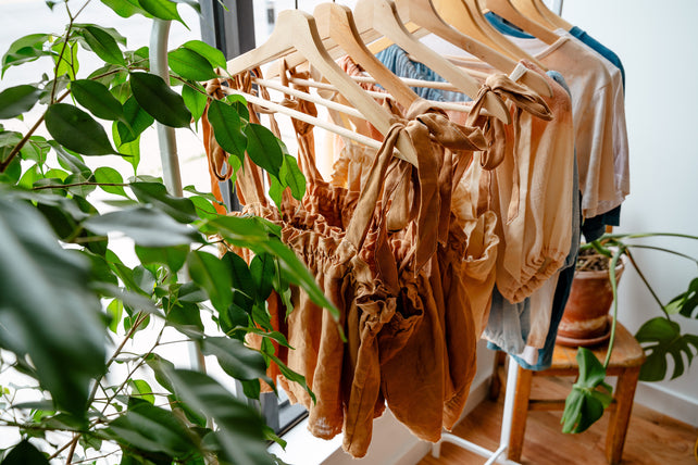 Rosemarine Textiles clothes (Linen Naturally Dyed Tank Top and shirts) hanging on rack 
